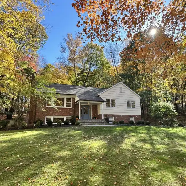MODERN SERENITY ON TWO ACRES OF WOODED PRIVACY