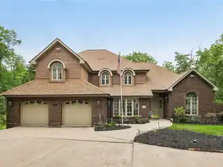 Cul-de-sac Wooded Retreat with 5-car Garages