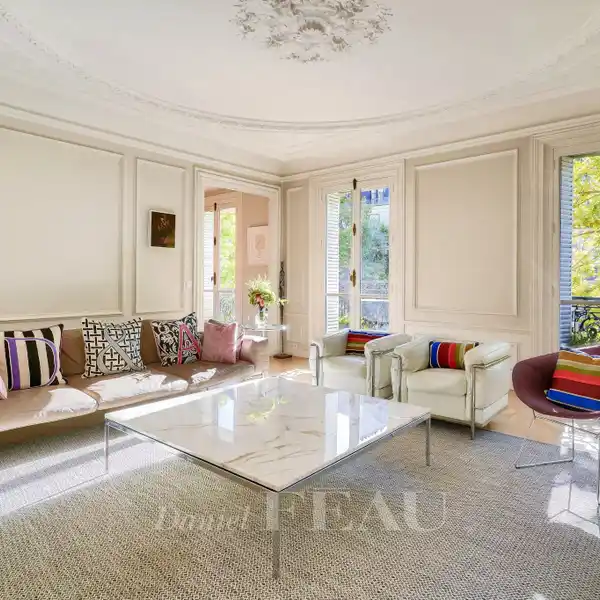 SUNLIT RESIDENCE WITH CONTINUOUS BALCONY ELEGANCE