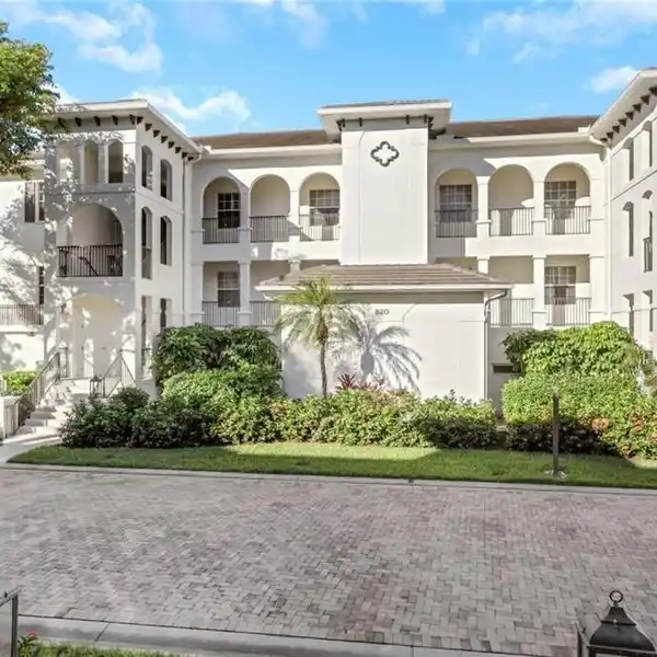 TOP-FLOOR RETREAT WITH EXPANSIVE TREETOP WATER VIEWS