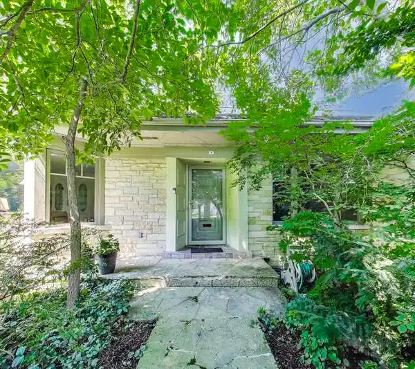 SUN-FILLED RANCH HOME ON A BEAUTIFULLY LANDSCAPED LOT