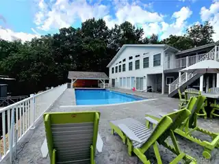 Gated Lakefront Retreat with Entertainer’s Dream