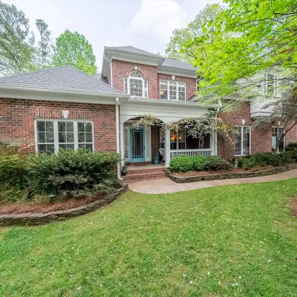 UNIQUE HOME ON TWO PRIVATE WOODED ACRES