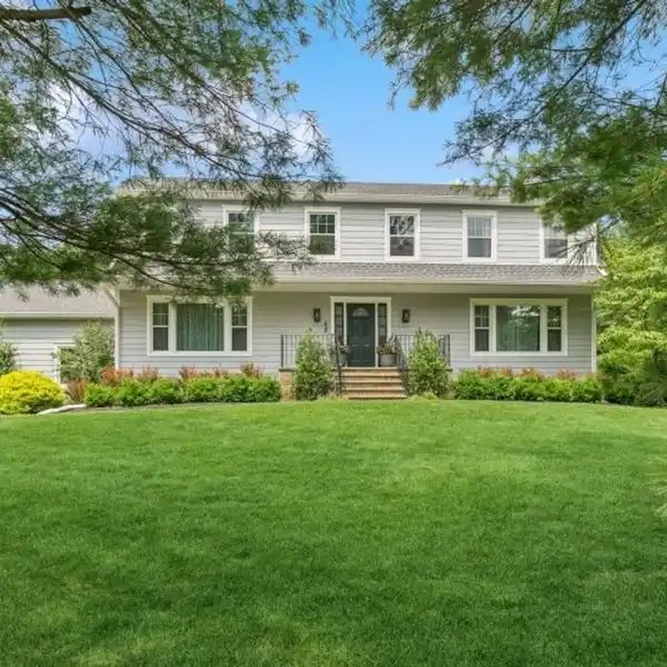 BEAUTIFULLY UPDATED COLONIAL IN A TRANQUIL SETTING