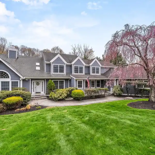 IMPECCABLE COLONIAL NESTLED ON ALMOST 2 PRIVATE ACRES