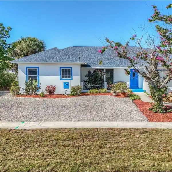 CHARMING CANAL-FRONT HOME WITH BREATHTAKING VIEWS