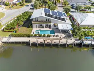 Expansive Waterfront Oasis with Solar-Powered Luxury