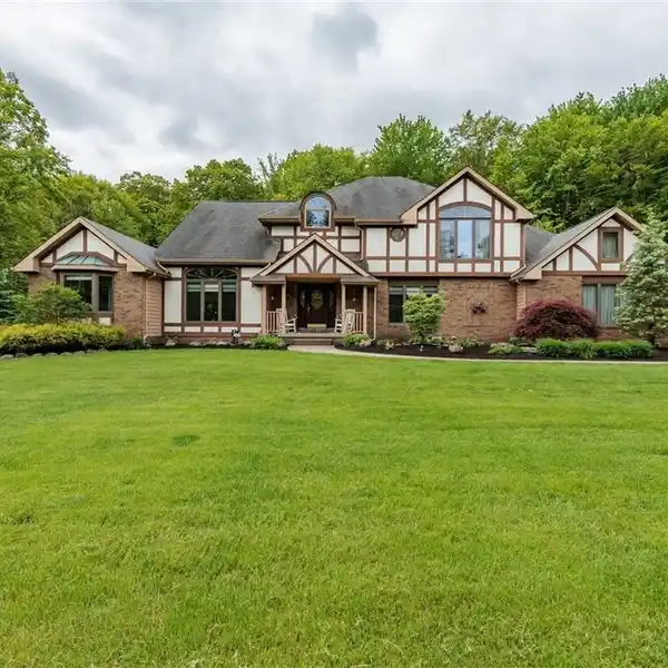 CUSTOM TUDOR ON NEARLY FIVE BEAUTIFUL ACRES