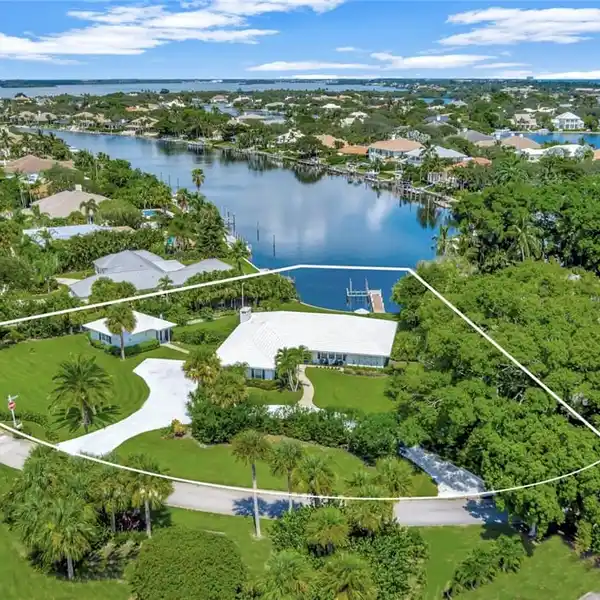 PRESTIGIOUS WATERFRONT LIVING WITH LUSH BACKYARD