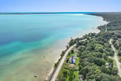 Beautifully Styled Retreat with 100 Feet of Private Sandy Frontage