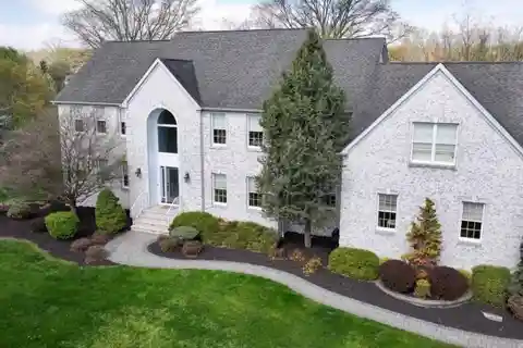 Elegant Home Boasts Grand Staircase and Pool
