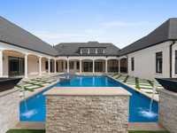 STUNNING ONE-LEVEL ESTATE SITUATED ON 4 ACRES