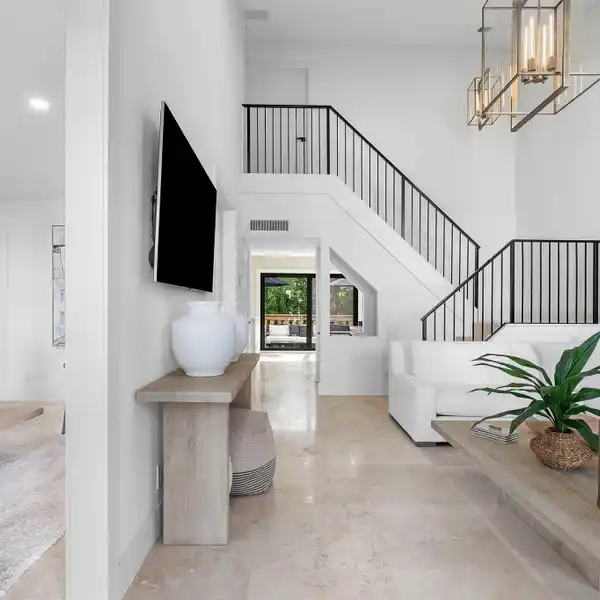 MODERN COASTAL ESCAPE STEPS FROM THE SAND