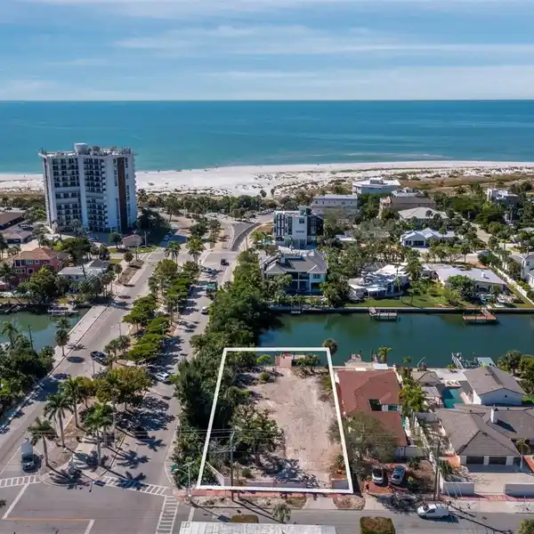 RARE OVERSIZED CORNER LOT STEPS FROM THE BEACH