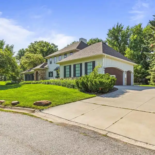 STYLISH TRANSITIONAL ONE AND A HALF STORY HOME