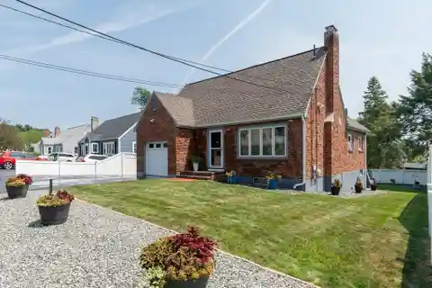 Meticulously Maintained and Expanded Cape Style Home