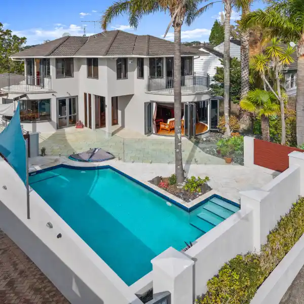 THREE-LEVEL HOME OFFERING INDOOR-OUTDOOR LUXURY LIVING