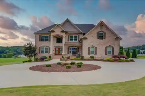 Grand Two-Story Foyer with Rich Hardwood Floors