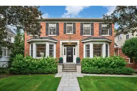 Charming Brick Home Set on Beautifully Landscaped Grounds