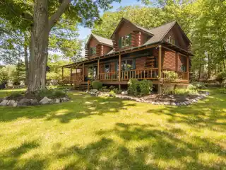 Beautifully Maintained Lakefront Log Home