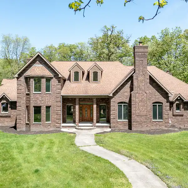 GRAND ALL-BRICK HOME ON OVER NINE ACRES
