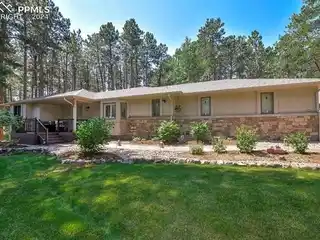Stunning Stucco and Stone Rancher in Desirable Woodmoor