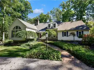 Sprawling Cape on a Magnificent Wooded Lot