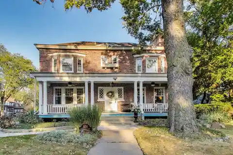 Timeless Riverside Elegance with Iconic Front Porch & Modern Upgrades