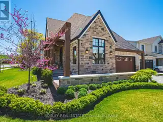 Custom-Designed Bungalow with Elegant Landscaping and Architectural Detail