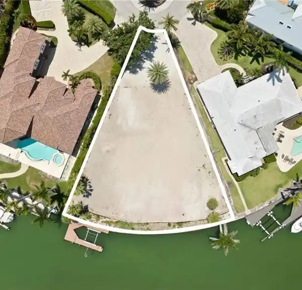 EXPANSIVE WATERFRONT LOT IN THE MOORINGS
