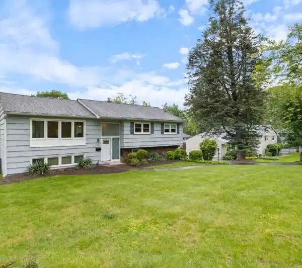 ENTERTAINER’S DREAM HOME WITH WALK-OUT BACKYARD DECK