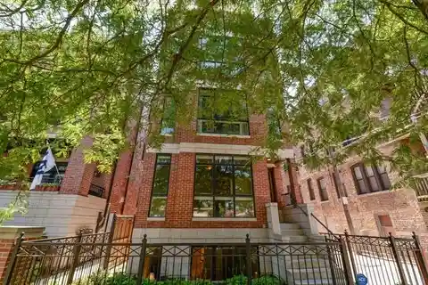 Exquisite Brick Duplex with Sophisticated Entertaining Spaces