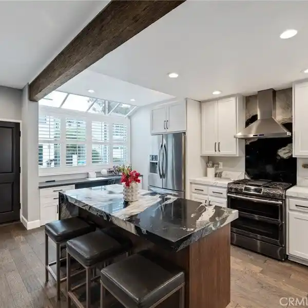EXTENSIVELY RENOVATED TOWNHOME BLOCKS FROM THE SAND
