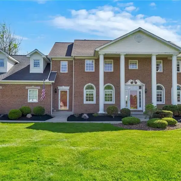 STUNNING BRICK-FRONT COLONIAL WITH SUNROOM RETREAT