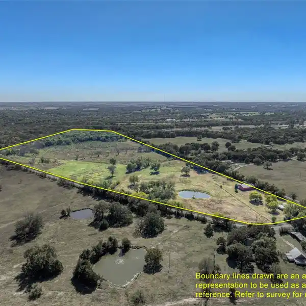 EXPANSIVE ACREAGE WITH VERSATILE BARNDOMINIUM RETREAT