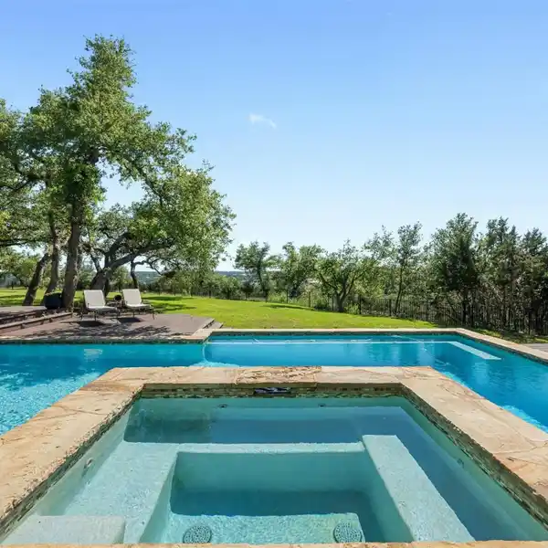 THE EPITOME OF HILL COUNTRY LIVING IN COVETED BELVEDERE