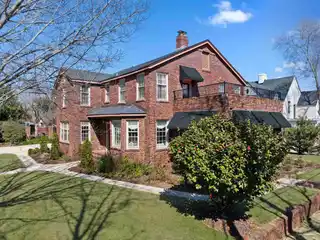 Tudor-style Brick Pool Home in Historic East Hill