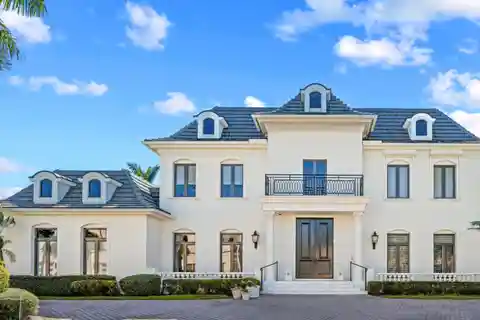 Exquisite Custom Home Nestled in the Heart of Boca Grove Plantation