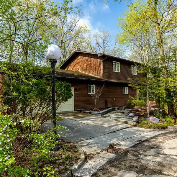 LIGHT-FILLED COLONIAL WITH AN UP-NORTH VIBE
