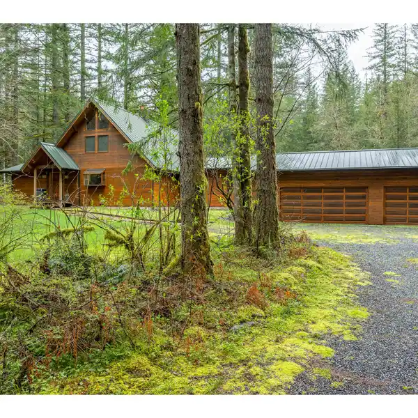 SCENIC CEDAR HOME WITH RIVER ACCESS AND GENEROUS ACREAGE