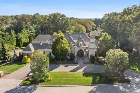 Custom Brick & Stone Masterpiece with 5 Ensuite Bedrooms