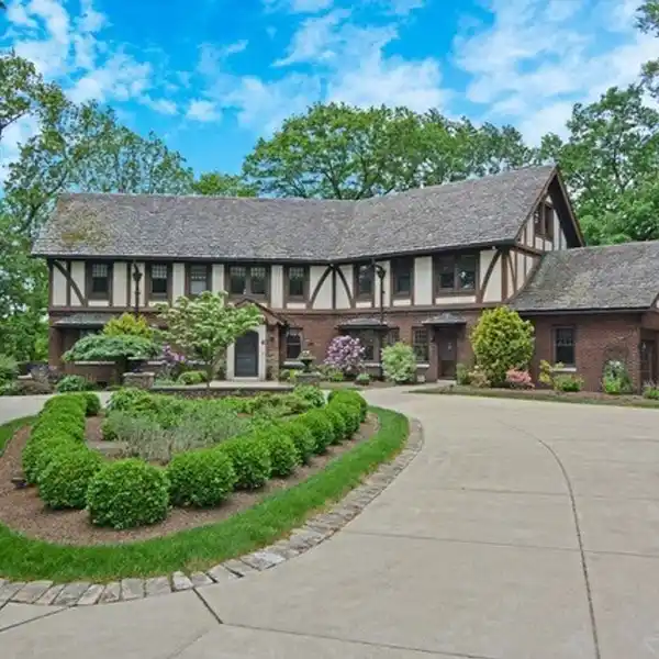 CLASSIC TUDOR WITH TODAY'S FLOOR PLAN AND LIFESTYLE NEEDS
