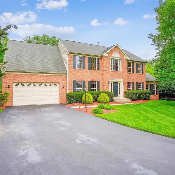COLONIAL RETREAT WITH POOLSIDE PARADISE AWAITS
