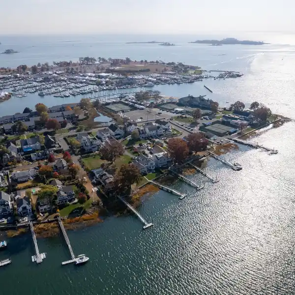A TRULY IMPECCABLE HOME WITH STATIONARY PIER AND FLOATING DOCK