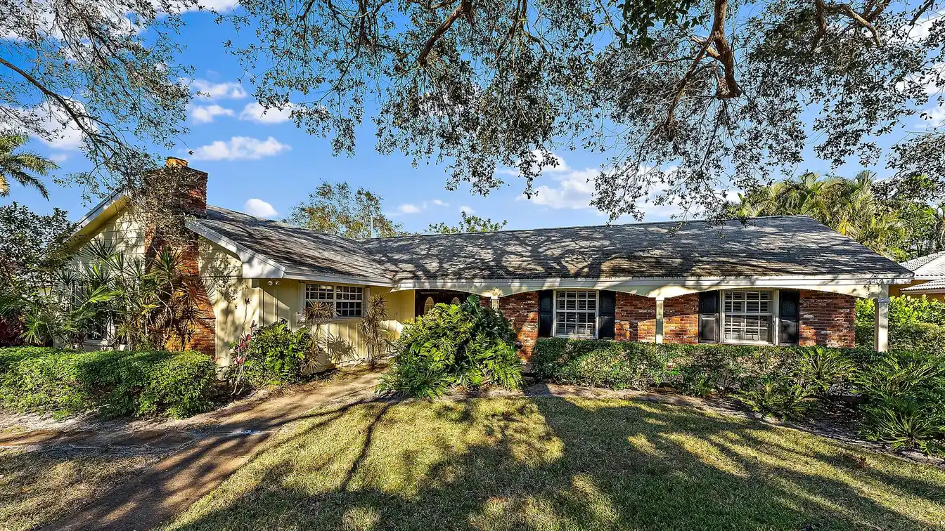 Delightful Home Nestled in the Sought-after Tequesta Country Club
