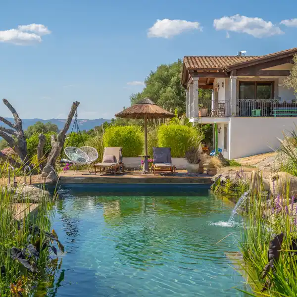 NATURE-INTEGRATED HOME WITH ECO-FRIENDLY BIOLOGICAL POOL