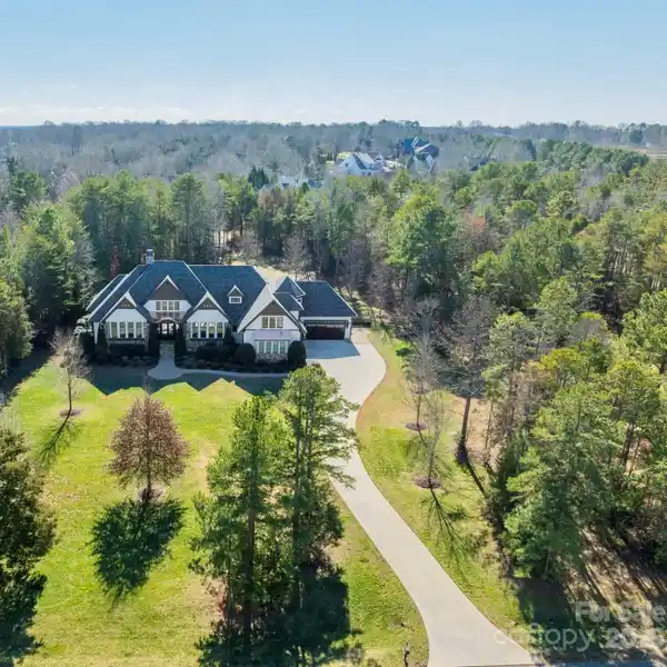 EXTRAORDINARY FIVE-ACRE WOODED ESTATE