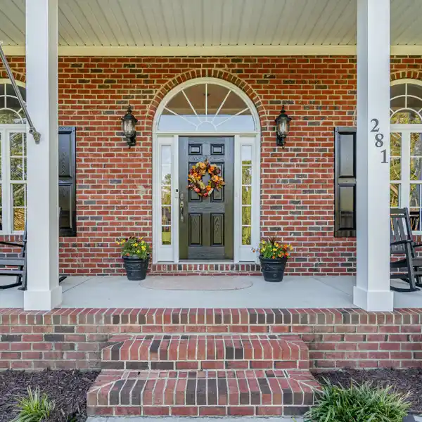 ELEGANT WATERFRONT LIVING BRICK RANCH