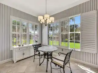 Upper-Floor End Unit with Panoramic Golf and Water Views