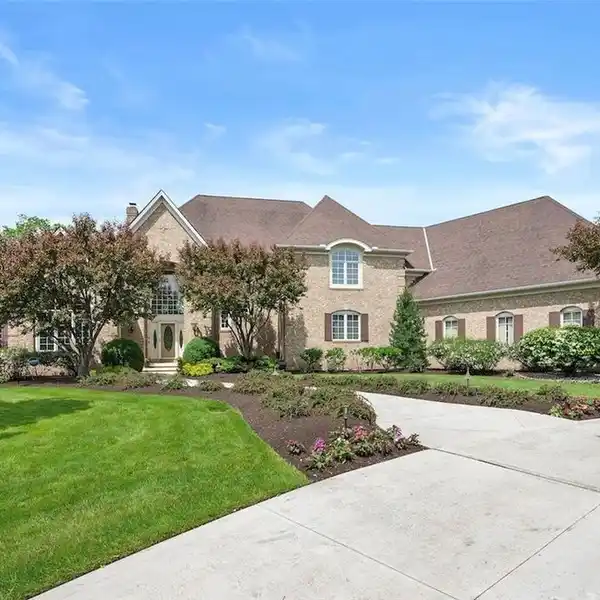 SUNLIT COLONIAL WITH EXPANSIVE PRIVATE BACKYARD